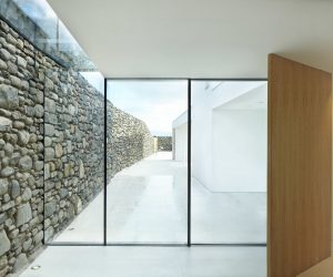 Skyframe sliding doors with structural frameless glass.